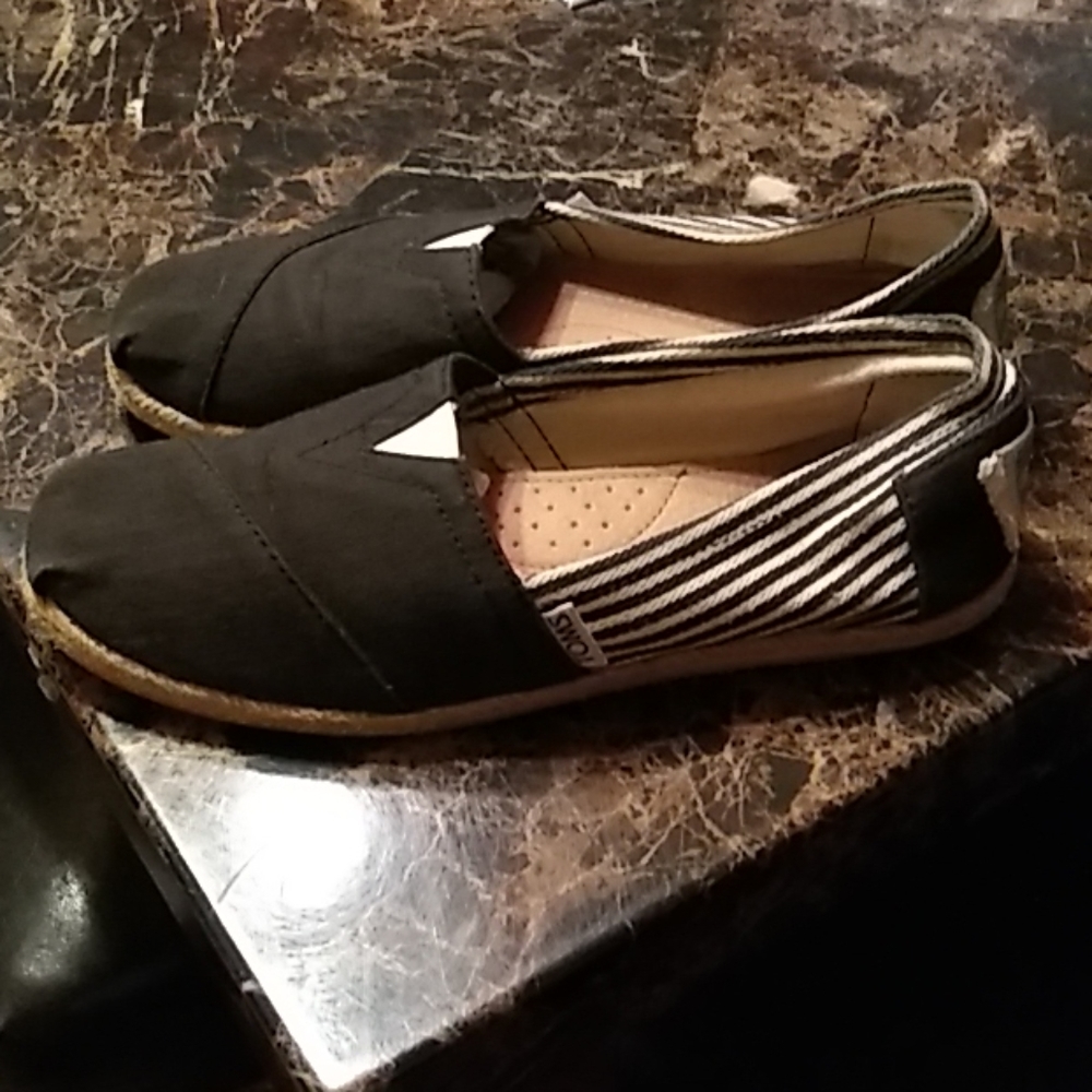 Sold. Black Toms